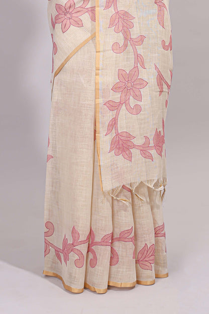 Cream floral design linen cotton saree with self zari border and matching printed blouse