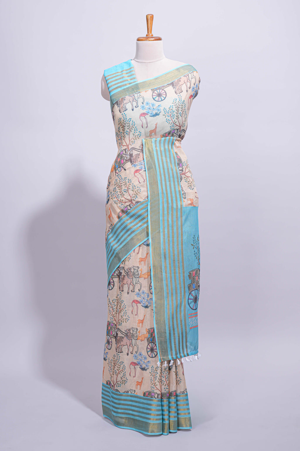 Pastel blue and beige linen cotton saree with animal motifs striped zari border and printed pallu with tassel along with contrast blouse