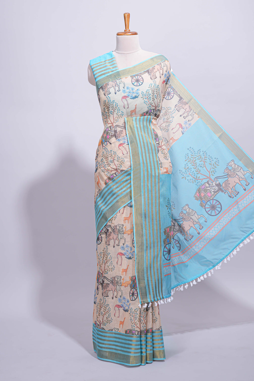 Pastel blue and beige linen cotton saree with animal motifs striped zari border and printed pallu with tassel along with contrast blouse