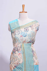 Pastel blue and beige linen cotton saree with animal motifs striped zari border and printed pallu with tassel along with contrast blouse