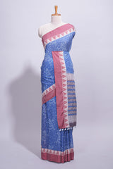 Blue linen small dotted elephant and floral motifs contrast border and printed pallu with geometric patterns and tassel detailing along with printed blouse