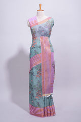 Turquoise linen saree withbodyfloral and traditional motifs with a contrastingpallu striped zari border and tassel along with contrast blouse