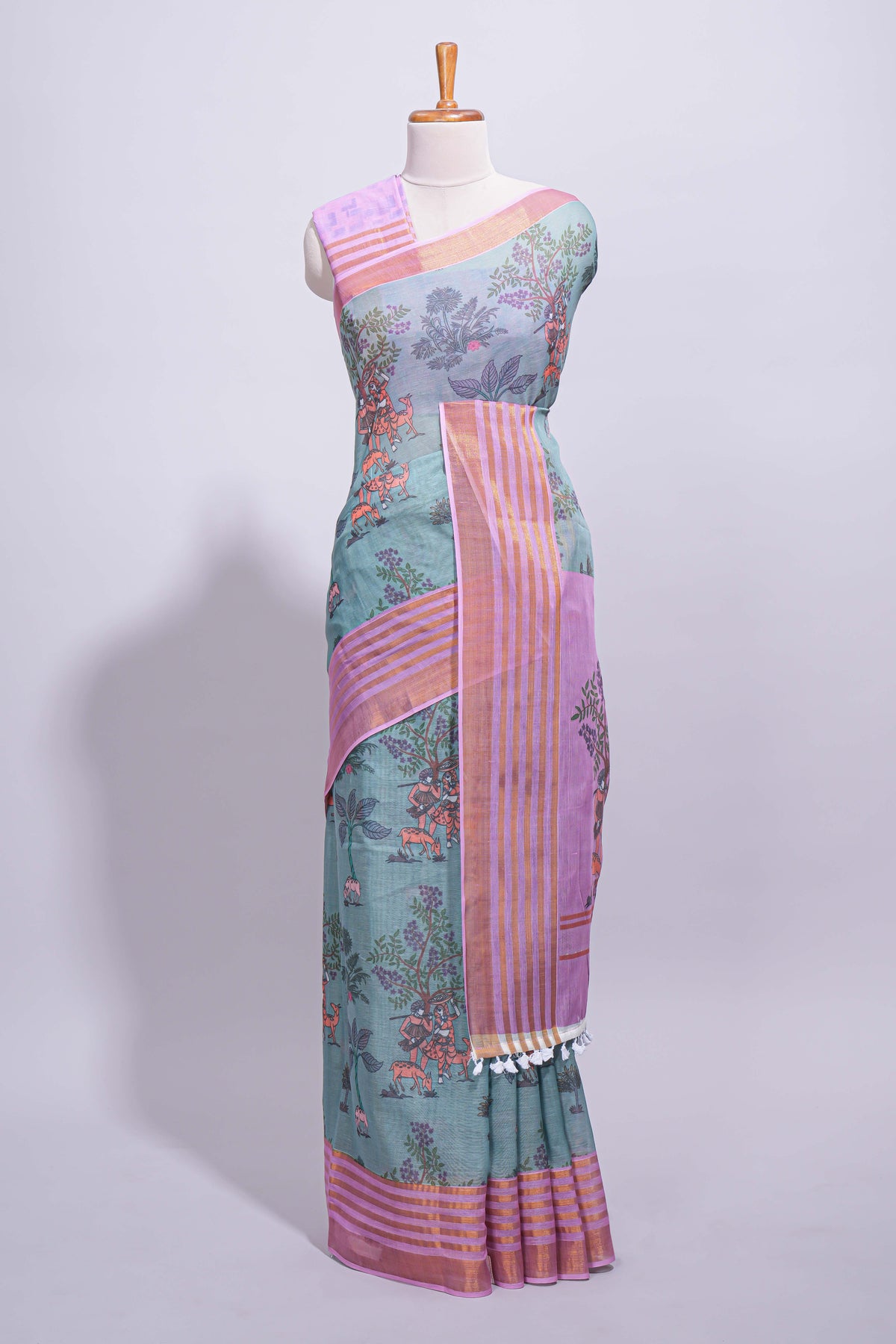 Turquoise linen saree with  body  floral and traditional motifs with a contrasting  pallu striped zari border and tassel along with contrast blouse