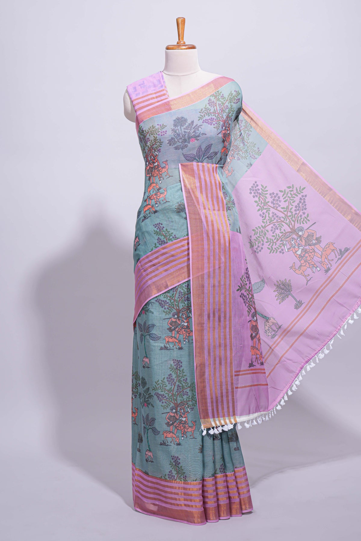 Turquoise linen saree with  body  floral and traditional motifs with a contrasting  pallu striped zari border and tassel along with contrast blouse
