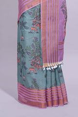 Turquoise linen saree withbodyfloral and traditional motifs with a contrastingpallu striped zari border and tassel along with contrast blouse