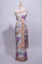 Ivory colour linen saree floral prints with pastel accents by a subtle gold zari border and printed pallu with tassel along with printed blouse