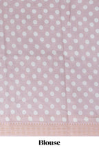 Ivory colour linen saree floral prints with pastel accents by a subtle gold zari border and printed pallu with tassel along with printed blouse