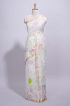 White linen saree floral prints with pastel accents by a subtle gold zari border andstriped pallu with tasselalong with self blouse