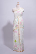 White linen saree floral prints with pastel accents by a subtle gold zari border and  striped pallu with tassel  along with self blouse