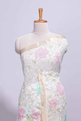 White linen saree floral prints with pastel accents by a subtle gold zari border andstriped pallu with tasselalong with self blouse