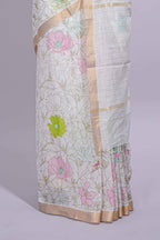 White linen saree floral prints with pastel accents by a subtle gold zari border and  striped pallu with tassel  along with self blouse