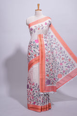Ivory with orange linen cotton saree with multicolourfloral vine print with a contrast border and printed pallu along with printed blouse