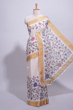 Ivory with yellow linen cotton saree with multicolour  floral vine print with a contrast border and printed pallu along with printed blouse