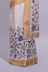 Ivory with yellow linen cotton saree with multicolourfloral vine print with a contrast border and printed pallu along with printed blouse
