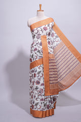 White with orange linen cotton saree with multicolourfloral vine print with a contrast border and printed pallu along with printed blouse
