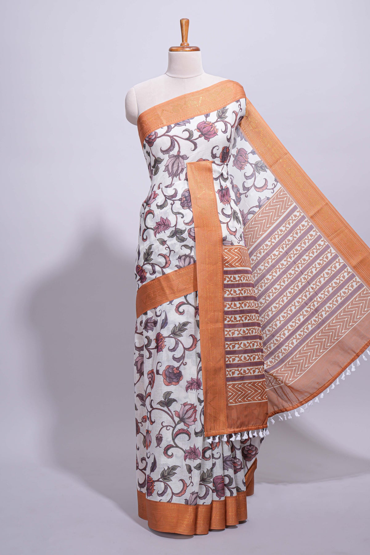 White with orange linen cotton saree with multicolour  floral vine print with a contrast border and printed pallu along with printed blouse