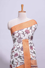 White with orange linen cotton saree with multicolourfloral vine print with a contrast border and printed pallu along with printed blouse