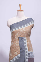 Brown linen small dotted elephant and floral motifs contrast border and printed pallu with geometric patterns and tassel detailing along with printed blouse
