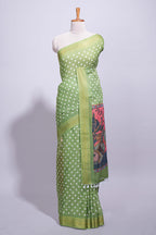 Green linen saree white polka dot pattern all over the body and self zari border with printed pallu along with printed blouse