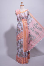 Lavender linen saree with  body  floral and traditional motifs with a contrasting  pallu striped zari border and tassel along with contrast blouse