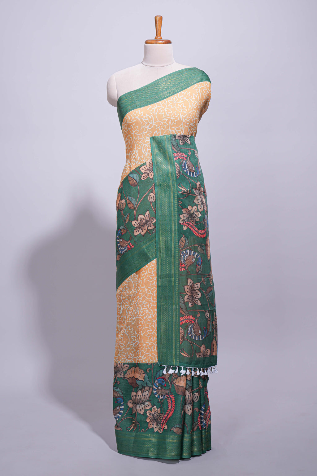 Linen saree with a mustard yellow and green  featuring floral patterns with a contrast  floral printed pallu and zari border with tassel