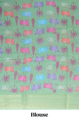 Blue linen saree with white dotted floral patterns with golden zari border and a multicolour pichwai motifs along with printed blouse