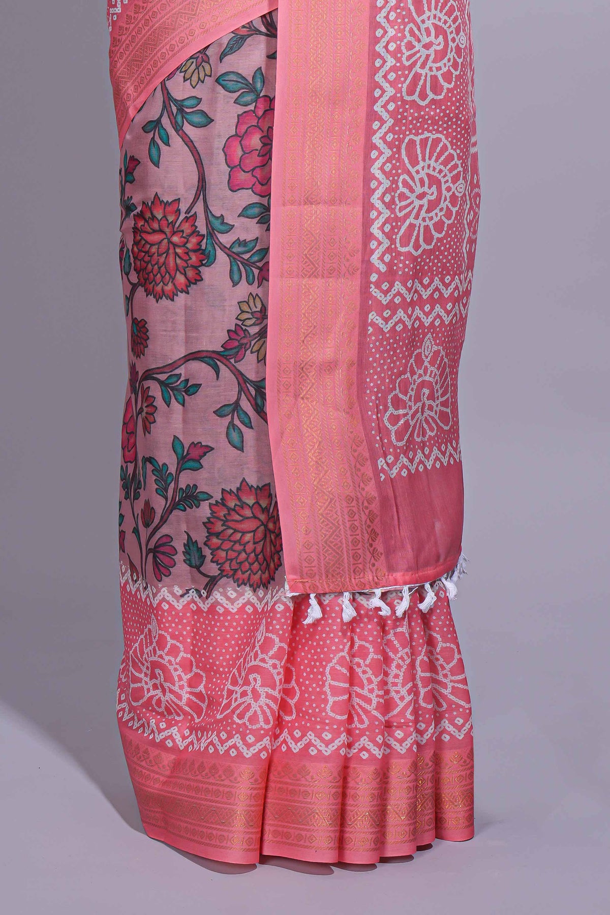 Linen saree with a pink colour  featuring floral patterns with a contrast  floral printed pallu and zari border with tassel along with contrast blouse