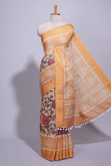 Linen saree with a orange colourfeaturing floral patterns with a contrastfloral printed pallu and zari border with tassel along with contrast blouse