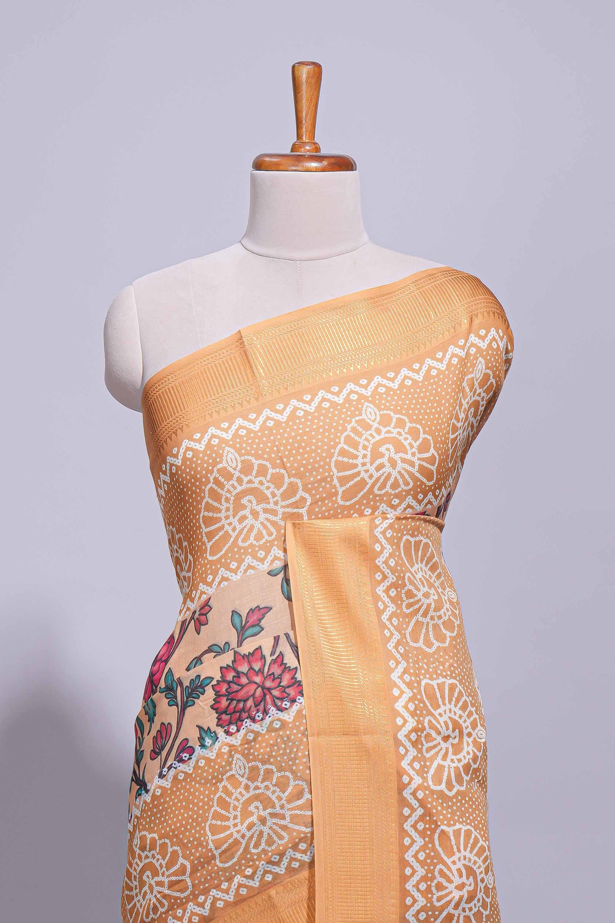 Linen saree with a orange colour  featuring floral patterns with a contrast  floral printed pallu and zari border with tassel along with contrast blouse