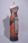 Elegant rust and charcoal linen saree with geometric dotted motifs paired with a floral printed pallu and contrast border with tassel along with printed blouse