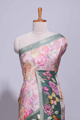 Soft pink linen saree with floral print highlighted with a contrast floral pallu and metallic zari border along with contrast blouse piece