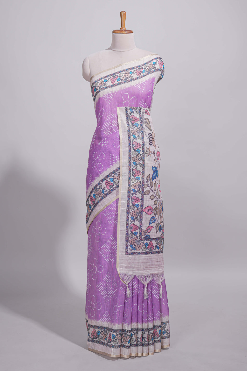 Lavender color linen saree with floral and geometric prints multicolour floral border and  printed pallu with tassels with a contrast blouse piece