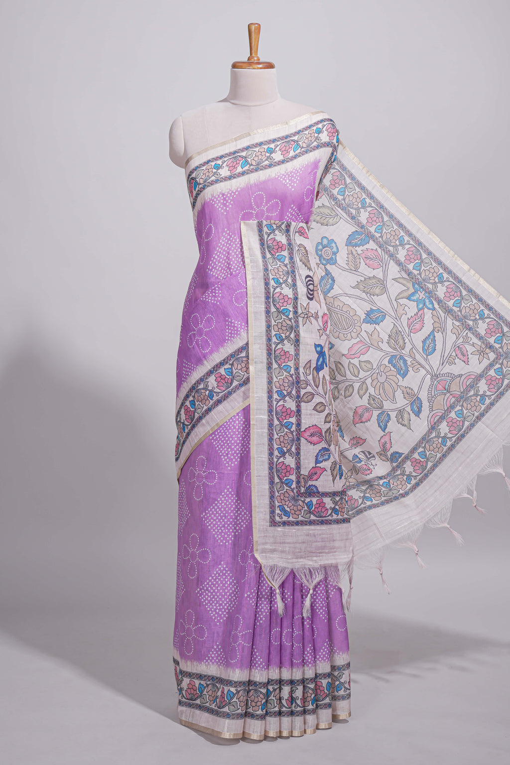 Lavender color linen saree with floral and geometric prints multicolour floral border and  printed pallu with tassels with a contrast blouse piece