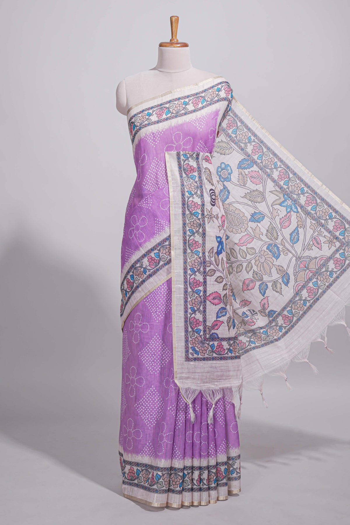 Lavender color linen saree with floral and geometric prints multicolour floral border and  printed pallu with tassels with a contrast blouse piece
