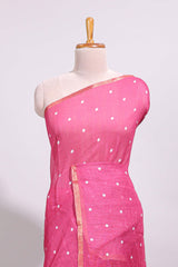 Pink round motifs linen saree with self zari border and contrast checked blouse