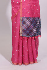 Pink round motifs linen saree with self zari border and contrast checked blouse