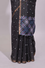 Black round motifs linen saree with self zari border and contrast checked blouse