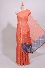 Orange round motifs linen saree with self zari border and contrast checked blouse