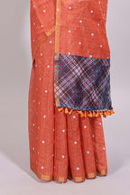 Orange round motifs linen saree with self zari border and contrast checked blouse