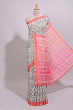 Cream warli design linen cotton saree with contrast zari border and contrast printed blouse