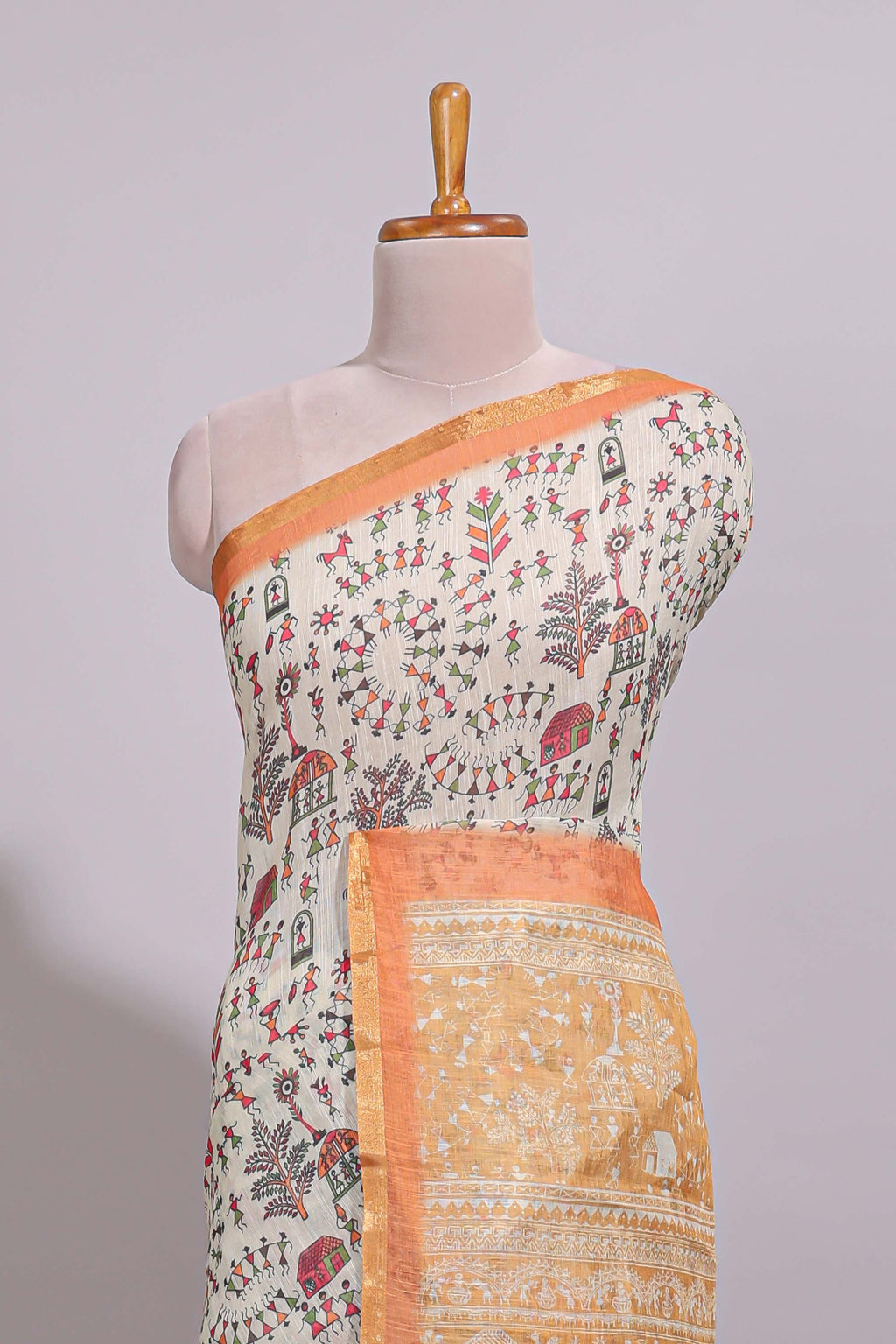 Cream warli design linen cotton saree with contrast zari border and contrast printed blouse