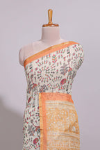 Cream warli design linen cotton saree with contrast zari border and contrast printed blouse
