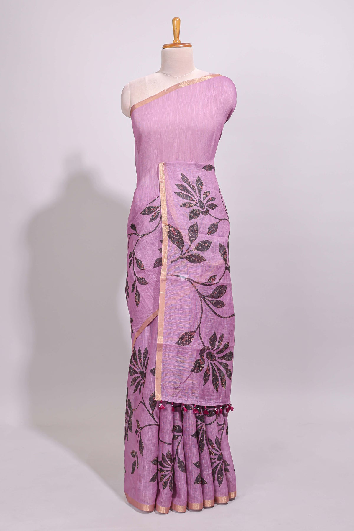 Mauve floral design linen cotton saree with self zari border and contrast floral print blouse