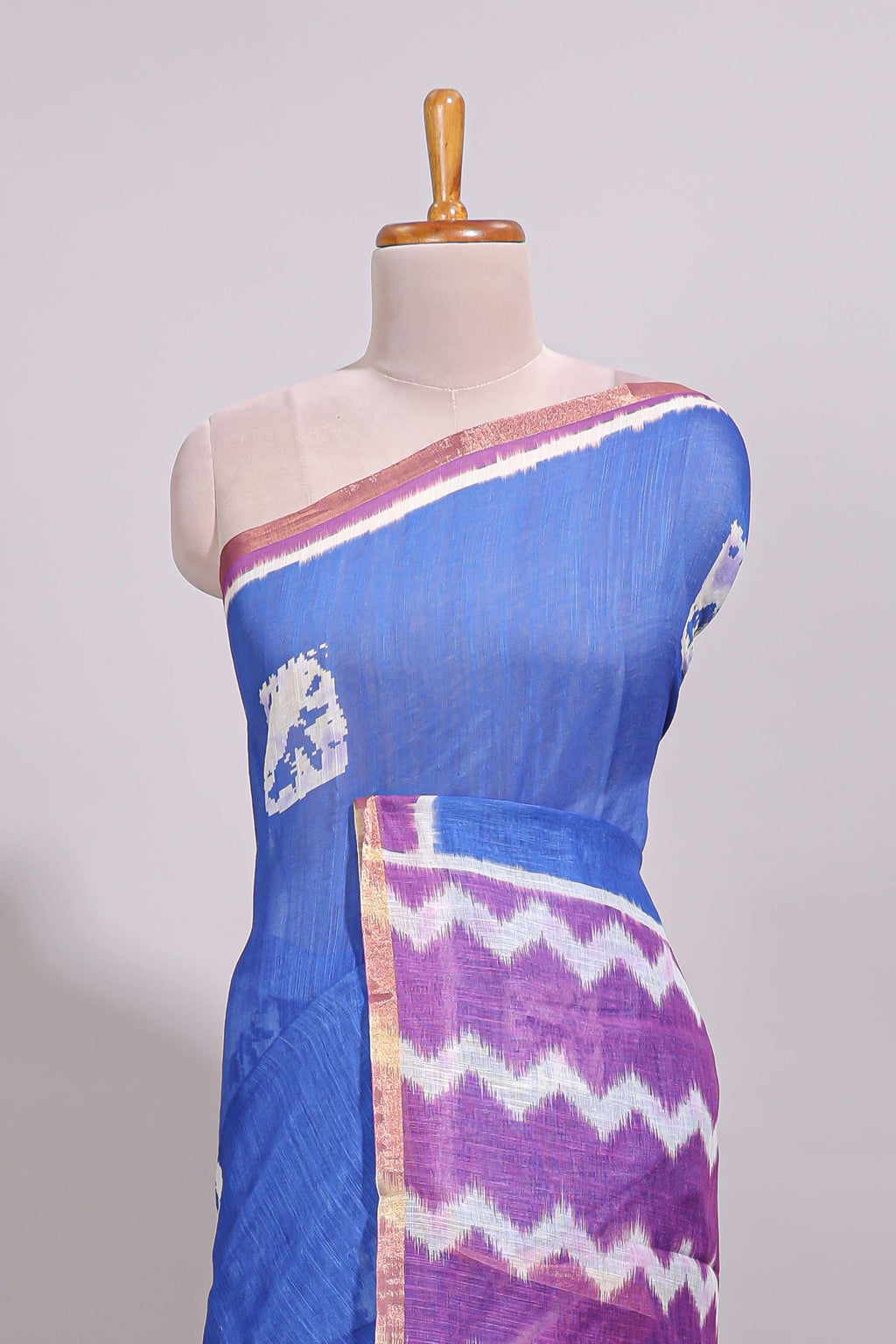 Blue geometric butta design linen cotton saree with contrast border and chevron design pallu
