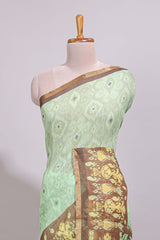 Green geometric ikkat design linen cotton saree with contrast zari border and printed blouse