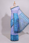 Blue geometric ikkat design linen cotton saree with contrast zari border and printed blouse