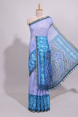 Blue geometric ikkat design linen cotton saree with contrast zari border and printed blouse