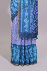 Blue geometric ikkat design linen cotton saree with contrast zari border and printed blouse