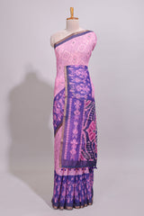 Pink geometric ikkat design linen cotton saree with contrast zari border and printed blouse