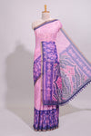 Pink geometric ikkat design linen cotton saree with contrast zari border and printed blouse